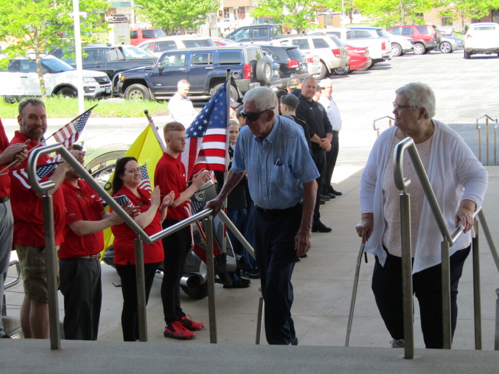 A veteran and his wife arrive at the pre-flight dinner, held at Bettendorf’s Waterfront Convention Center, for veterans going on the next Honor Flight. CREDIT DAVE THOMPSON
