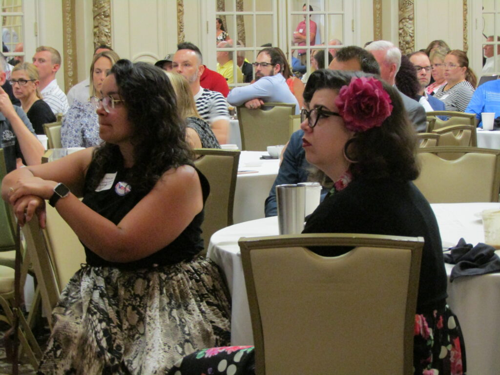 Downtown stakeholders and supporters listen to the Downtown Davenport Partnership’s annual meeting presentation Tuesday, June 28.