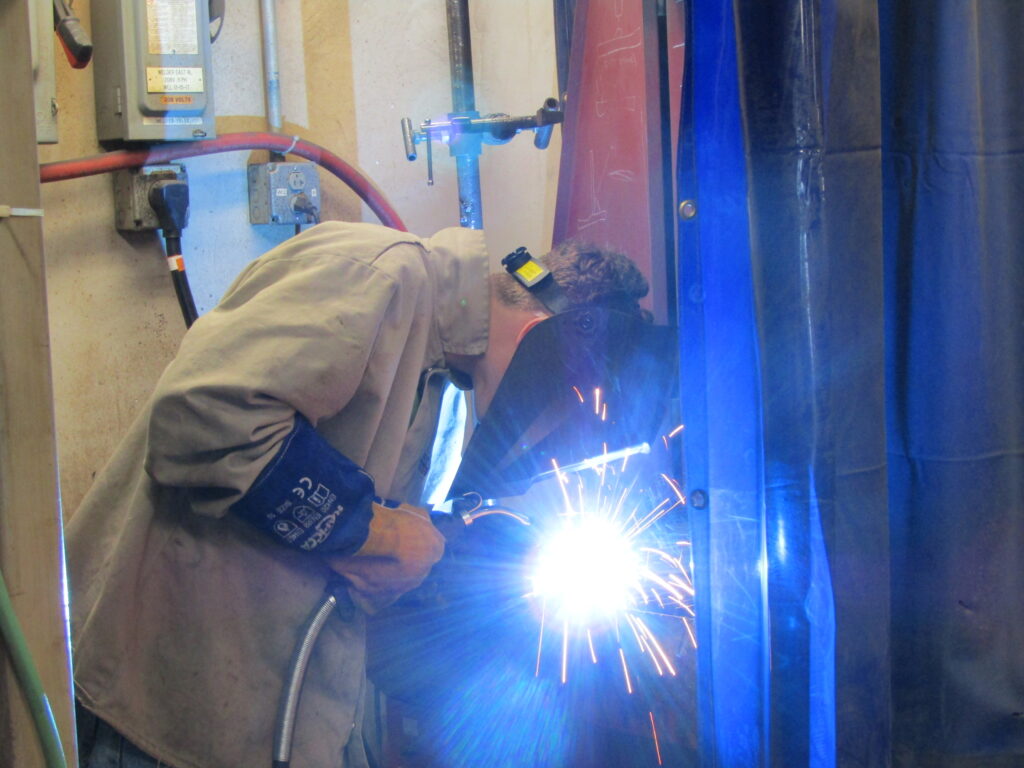A student participates in a recent welding competition hosted by Eastern Iowa Community Colleges.
