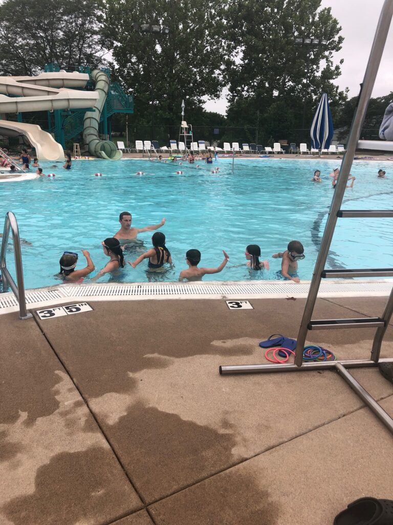 Young people enjoy a swim at the Splash Landing Family Aquatic Center in Bettendorf. The public swimming pool has now been closed for the summer because of deteriorating paint in the pool that is causing safety concerns.