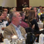 Attendees listen to a speech
