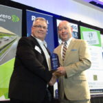 Dave Larson, left, business administrator for the Revive At The Group Medical Spa, receives the QCBJ’s award for the Fastest Growing Company in the region from John Lohman, Corridor Media Group publisher. A total of 15 companies were recognized at the reception on Tuesday, Aug. 9, at Bally's Quad Cities in Rock Island.