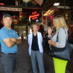 Kathy La Plante, center, Main Street America’s senior program officer and director of coordinating program services, visits with Robbie Wolfe, a star of the TV series “American Pickers” at his shop in Davenport, and Molly Otting Carlson, Hilltop Campus Village executive director, during a tour of Davenport’s Hilltop on Thursday, Aug. 18.