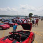 Corvettes line the LeClaire parking lot by the Mississippi River for the popular Vettes on the River car show.