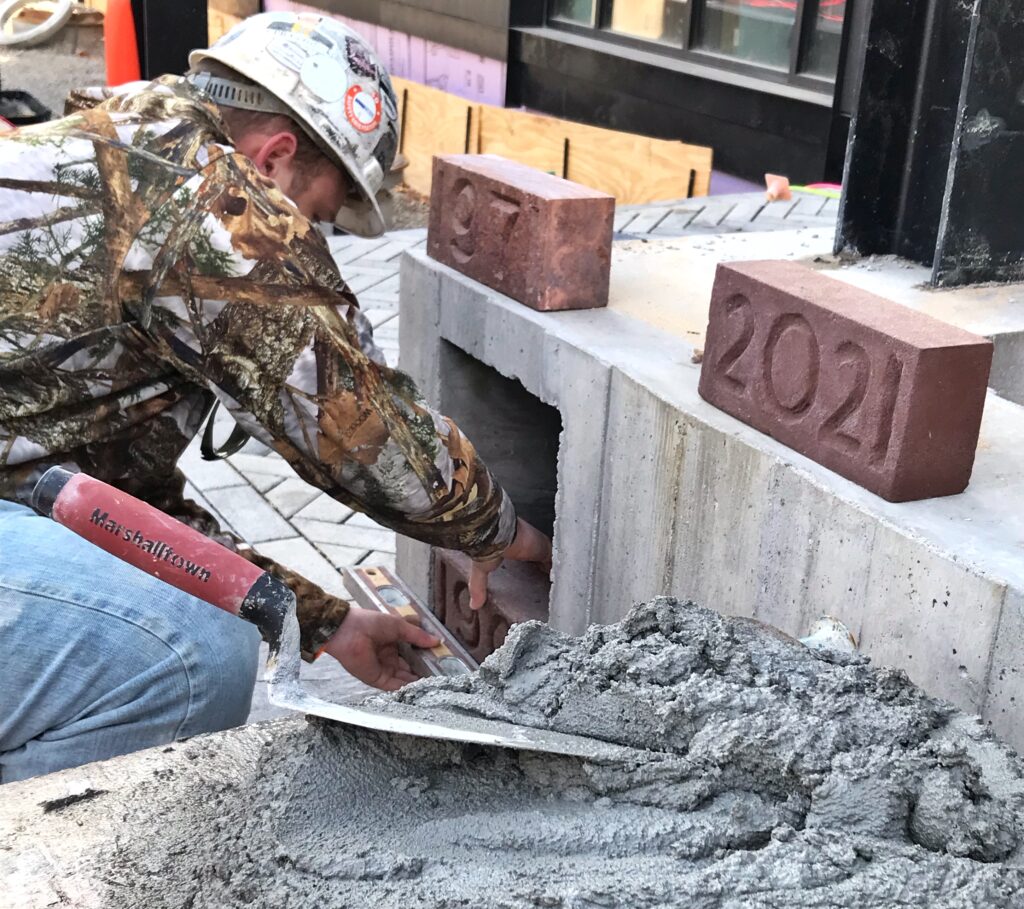 The Stanley Center for Peace and Security placed a time capsule behind three cornerstones to seal in the 122-year legacy of the site of its new headquarters. Its legacy grows as the first Living Building in Iowa and one of only 30 in the world.