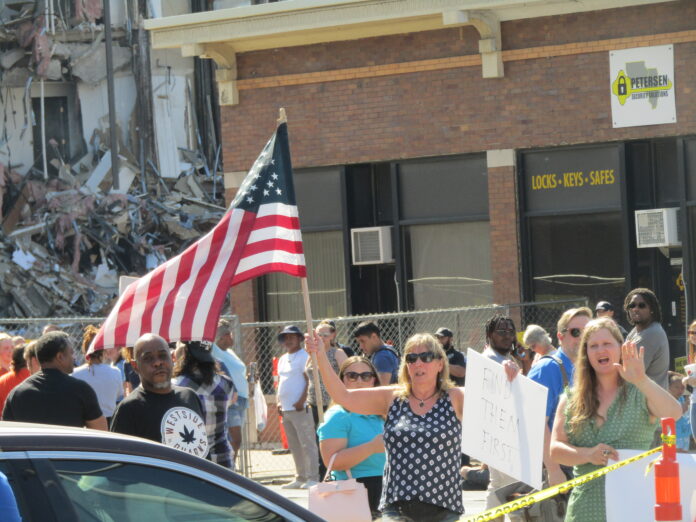 Building2 Protests near collapsed apartment building
