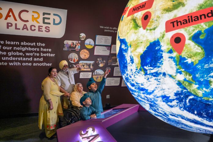 PM_Family Enjoying Sacred Places Exhibit