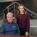 Russell Chairman and CEO Jim Russell and President Caitlin Russell pictured in Russell’s Quad Cities office. CREDIT TODD WELVAERT
