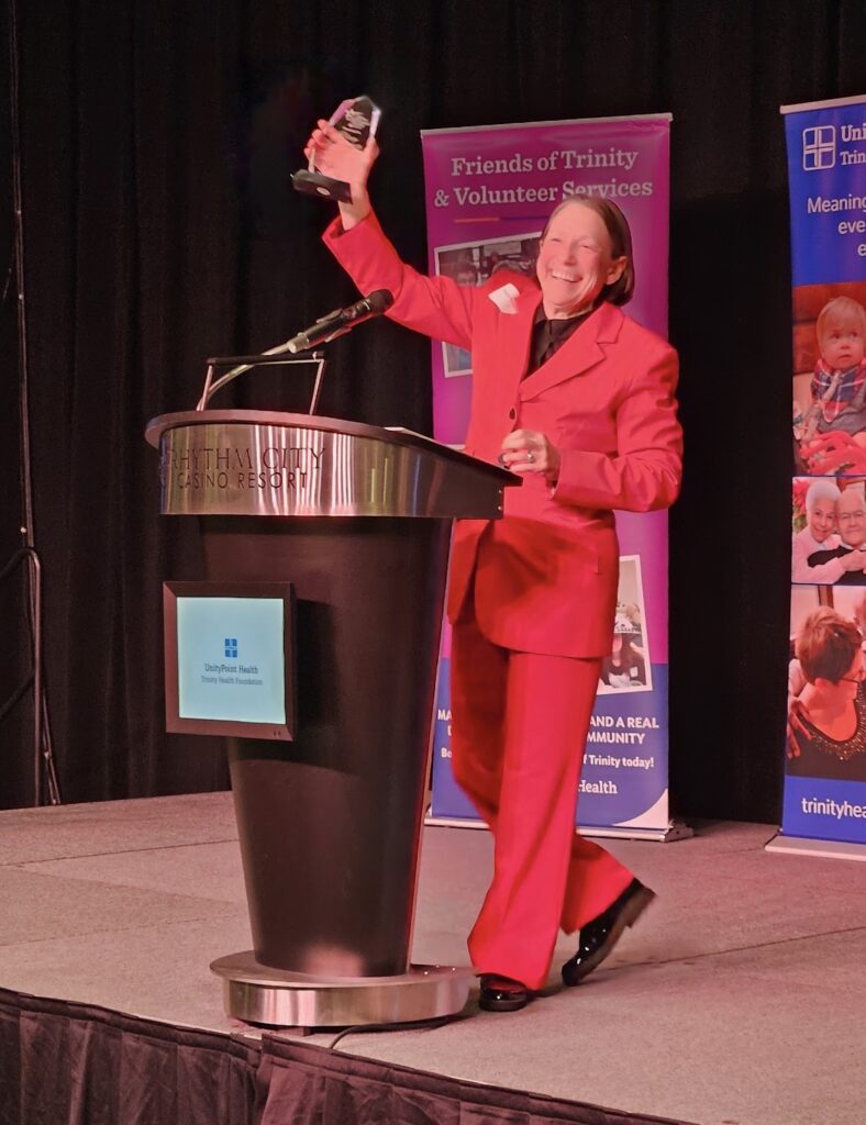 Tracy Poelvoorde, Trinity College of Nursing chancellor celebrates her Lifetime Achievement Award for Community Health Improvement. She received the honor on fWednesday, March 25, from the college, Friends of Trinity, and Trinity Health Foundation. CREDIT TRINITY COLLEGE OF NURSING & HEALTH SCIENCES