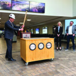 Benjamin Leischner, executive director of the Quad Cities International Airport, slams a sledgehammer into a mock brick floor in late April kicking off Project Gateway’s Phase Two construction. CREDIT JENNIFER DEWITT