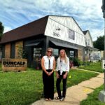 Davenport economic development leaders Susanne Knutsen, left, and Samantha Johnson, pose by Duncalf Chiropractic, which underwent an exterior transformation thanks to a Commercial DREAM grant. CREDIT JENNIFER DEWITT