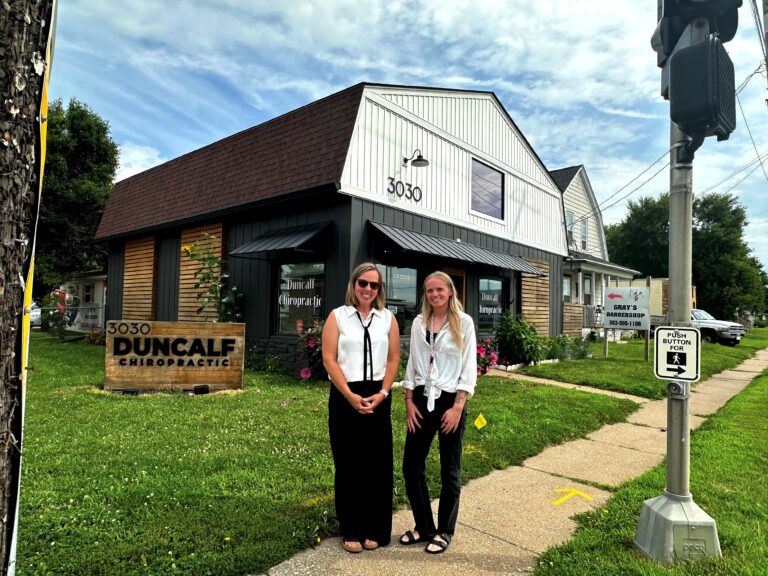 Davenport economic development leaders Susanne Knutsen, left, and Samantha Johnson, pose by Duncalf Chiropractic, which underwent an exterior transformation thanks to a Commercial DREAM grant. CREDIT JENNIFER DEWITT
