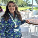Wendy Williams, the 2026 John Deere Classic chair, poses in title sponsor John Deere’s hospitality suite. The additional outdoor area overlooks the 18th green, providing more space for the company and its customers, dealers and other guests. CREDIT JENNIFER DEWITT