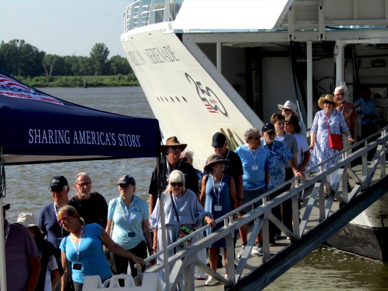 Passengers disembark from the American Serenade river cruise ship on the Muscatine riverfront on Monday morning, June 29. Around 155 people from the ship spent the morning in Muscatine.